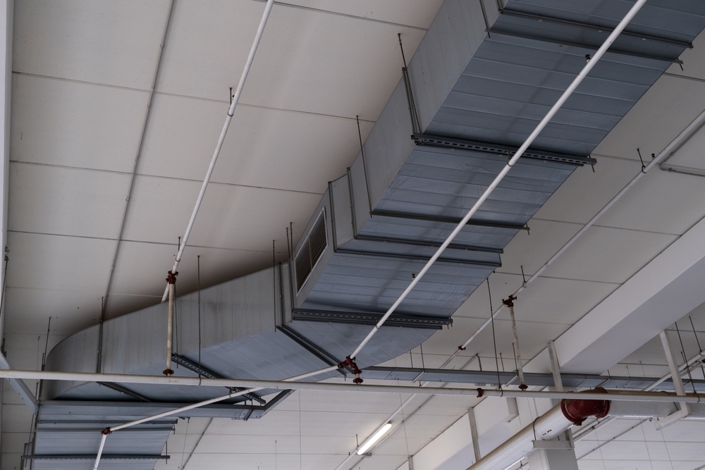 industrial air duct system on the ceiling of a building