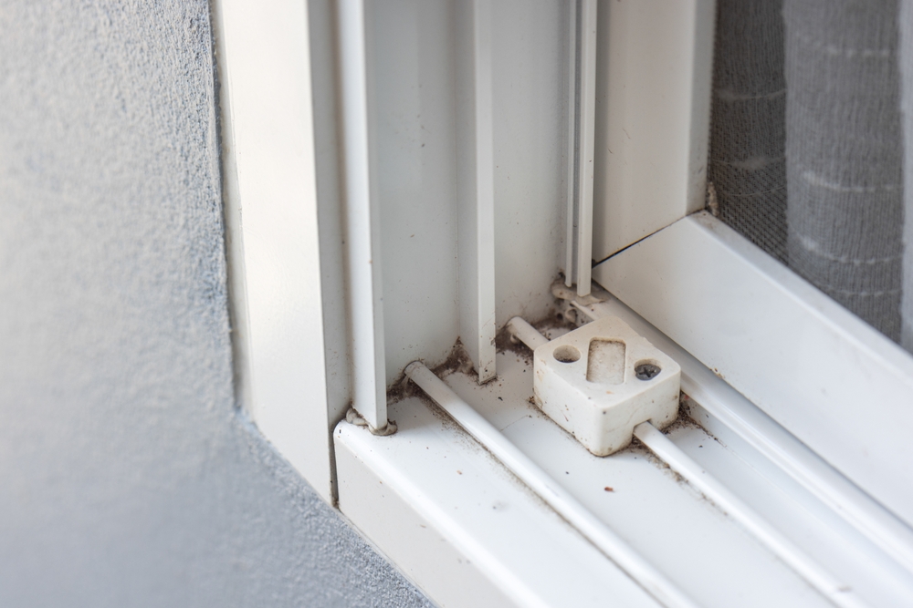 dirty window track in need of cleaning