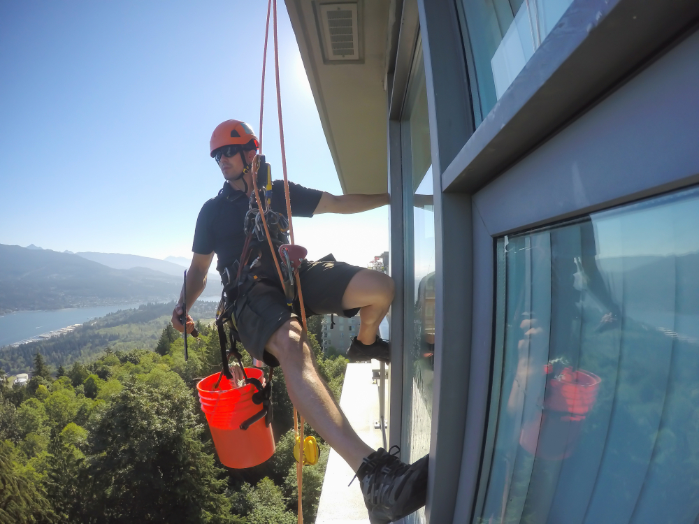 person performing commercial cleaning services on a building